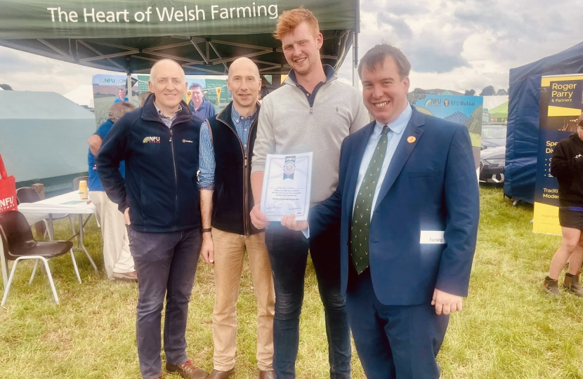 Morgan Tudor receiving his NFU Community Hero award