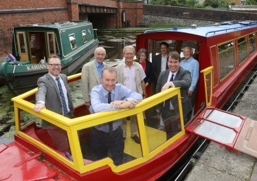 Photo shows (L-R) Russell George MS, John Dodwell – Chair of Montgomery Canal Partnership, Secretary of State for Wales Simon Hart, Owen Paterson MP, Cllr Rosemarie Harris – Leader of Powys County Council, Mark Evans - Director for Wales and South West from the Canal and River Trust/Glandwr Cymru, Craig Williams MP and Pat Ward – Vice-Chairman of the Heulwen Trust.